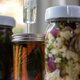 jars of vegetables being fermented